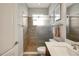This bathroom features a walk-in shower with glass door and a vanity with white countertop at 6008 Apex Way, Lady Lake, FL 32159