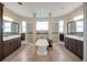 Bathroom featuring a soaking tub, dual vanities, and separate shower area at 6008 Apex Way, Lady Lake, FL 32159