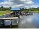 Community boat slips with multiple covered boats docked at 6008 Apex Way, Lady Lake, FL 32159