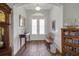 Inviting foyer with wood floors, and double front doors for natural light at 6008 Apex Way, Lady Lake, FL 32159