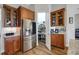 This modern kitchen features stainless steel appliances and wooden cabinetry at 6008 Apex Way, Lady Lake, FL 32159