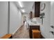 Functional laundry room with wood look tile, sink, plenty of storage, and easy access to the washer and dryer at 6008 Apex Way, Lady Lake, FL 32159