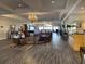 Sophisticated lobby with hardwood floors, elegant chandelier, and staircase at 6008 Apex Way, Lady Lake, FL 32159