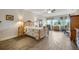 Bright main bedroom featuring tile floors, a ceiling fan, and natural lighting at 6008 Apex Way, Lady Lake, FL 32159