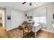 A bright office area features an arm chair, hardwood floors, and a storage closet at 6008 Apex Way, Lady Lake, FL 32159