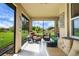 Enjoy the outdoors on this screened-in porch with comfy seating, perfect for entertaining at 6008 Apex Way, Lady Lake, FL 32159