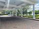 Elegant porte cochere with brick drive and fountain at 6008 Apex Way, Lady Lake, FL 32159