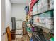 Storage room featuring shelves and storage bins at 6008 Apex Way, Lady Lake, FL 32159
