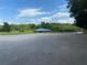 A scenic waterfront building with picnic tables visible from the parking lot and a lovely view of the water at 6008 Apex Way, Lady Lake, FL 32159