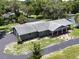 This aerial view showcases the roof and manicured landscaping around the attractive single-story home at 604 Ponderosa Dr, St Cloud, FL 34769