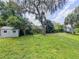 Backyard with shed, storage and trees at 604 Ponderosa Dr, St Cloud, FL 34769
