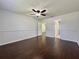 Spacious bedroom with hardwood floors, a ceiling fan, and two closets at 604 Ponderosa Dr, St Cloud, FL 34769