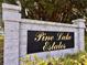 A quaint, brick sign welcomes you to the lovely Pine Lake Estates neighborhood at 604 Ponderosa Dr, St Cloud, FL 34769