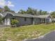 Beautiful single-story home with attached two-car garage surrounded by a lush green lawn and landscape at 604 Ponderosa Dr, St Cloud, FL 34769