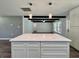 Open concept kitchen with island, stainless appliances, and view to living area at 604 Ponderosa Dr, St Cloud, FL 34769