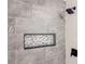 A modern shower featuring stylish gray tile, a built-in niche, and sleek fixtures at 604 Ponderosa Dr, St Cloud, FL 34769