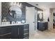 Modern bathroom features double sinks, stylish mirrors, and a sleek, open design at 637 Neptune Dr, Groveland, FL 34736
