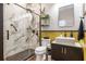 Modern bathroom with stylish tiles, glass shower, black hardware, and under sink storage at 637 Neptune Dr, Groveland, FL 34736