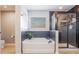 Luxurious bathroom features a soaking tub, walk-in shower, modern fixtures, and stylish design at 637 Neptune Dr, Groveland, FL 34736