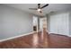 Open bedroom boasts hardwood floors, ample closet space, and access to an ensuite bathroom at 637 Neptune Dr, Groveland, FL 34736