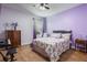 Cozy bedroom with hardwood floors, closet, and plenty of space for furniture at 637 Neptune Dr, Groveland, FL 34736