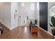 Grand entryway featuring high ceilings, wood-look floors, stylish staircase, and lots of natural light at 637 Neptune Dr, Groveland, FL 34736