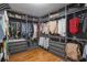 Organized walk-in closet with custom shelving, ample storage, and hardwood floors at 637 Neptune Dr, Groveland, FL 34736