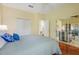 Bright bedroom featuring hardwood floors, a sliding glass door and neutral-toned walls at 645 Highlands Hammock Dr, Kissimmee, FL 34759