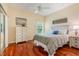 Bright bedroom features hardwood floors, a ceiling fan, and a serene ambiance at 645 Highlands Hammock Dr, Kissimmee, FL 34759