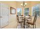 Cozy breakfast nook with large windows, decorative lighting, and tile flooring at 645 Highlands Hammock Dr, Kissimmee, FL 34759