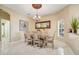 Formal dining room with a large mirror, chandelier, and light yellow walls at 645 Highlands Hammock Dr, Kissimmee, FL 34759