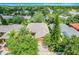 Charming single-Gathering home with brick paver driveway and lush landscaping including mature trees and meticulous garden beds at 645 Highlands Hammock Dr, Kissimmee, FL 34759