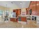Spacious kitchen features granite countertops, stainless appliances, and a center island at 645 Highlands Hammock Dr, Kissimmee, FL 34759