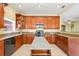 Updated kitchen with stainless appliances, granite countertops, and an island perfect for entertaining at 645 Highlands Hammock Dr, Kissimmee, FL 34759
