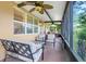 Spacious screened porch featuring comfortable seating and ceiling fans at 645 Highlands Hammock Dr, Kissimmee, FL 34759