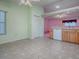 Eat-in kitchen featuring wood cabinets, and tile flooring at 712 Old Oaks Ln, Leesburg, FL 34748