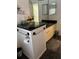Bathroom featuring black countertops, a toilet paper holder and a large mirror at 724 Rosemere Cir, Orlando, FL 32835