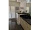 Bathroom featuring black countertops, a large mirror, and window with plantation shutters at 724 Rosemere Cir, Orlando, FL 32835