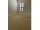 Bedroom with neutral carpet and large window providing plenty of sunlight at 724 Rosemere Cir, Orlando, FL 32835