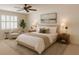 Bright bedroom featuring a ceiling fan, neutral tones, and comfortable furnishings at 724 Rosemere Cir, Orlando, FL 32835