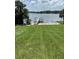 A well-maintained dock extends into the lake, providing access for fishing or enjoying water activities at 724 Rosemere Cir, Orlando, FL 32835