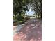 Charming brick-paved community entrance with lush landscaping, mature trees, and a welcoming atmosphere at 724 Rosemere Cir, Orlando, FL 32835