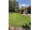 Well-manicured lawn with colorful landscaping surrounding the beautiful home at 724 Rosemere Cir, Orlando, FL 32835