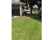 Spacious front lawn with neatly kept landscaping and brick walkway at 724 Rosemere Cir, Orlando, FL 32835