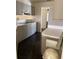 Kitchen featuring sleek cabinets and a contrasting dark tiled floor at 724 Rosemere Cir, Orlando, FL 32835