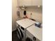Close up of the laundry area, featuring a modern washer and dryer with storage at 724 Rosemere Cir, Orlando, FL 32835