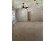 Large living room features neutral carpet, ceiling fan, and window with plantation shutters at 724 Rosemere Cir, Orlando, FL 32835