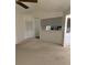Neutral living space with closet and bar area to adjacent kitchen at 724 Rosemere Cir, Orlando, FL 32835