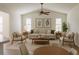 Open-concept living room with vaulted ceilings and a ceiling fan, creating a welcoming atmosphere at 724 Rosemere Cir, Orlando, FL 32835