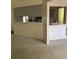 Neutral living space with closet and bar area to adjacent kitchen at 724 Rosemere Cir, Orlando, FL 32835
